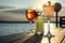 Glasses of fresh summer cocktails on wooden table at sunset, low angle view. Space for text