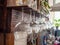 Glasses hang over the bar counter. The glasses are turned upside down. restaurant interior. Concept of drinking alcoholic