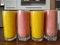 Glasses of healthy colorful nutritious fruit smoothies placed in the kitchen
