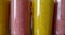 Glasses of healthy colorful nutritious fruit smoothies protein shake drinks closeup of colors