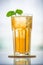 Glasses of iced tea with mint on wooden coaster background