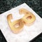 Glasses icon. Bronze Glasses symbol on white marble podium