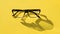 Glasses isolated on yellow background