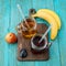 Glasses of juise with fruits on table