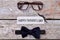 Glasses, mustache and bow tie.