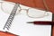 Glasses, notepad with pen