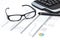 Glasses and pen on a printed web analytics report