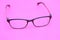 Glasses on the pink scene