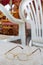 Glasses on plastic chair in monastery at ceremony, close up view