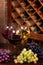 Glasses of red, rose and white wine with cheese, and grape in wine cellar