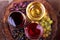 Glasses of red, rose and white wine with grape in wine cellar. Food and drinks concept.