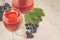 glasses of red wine and grape/glasses of red wine and grape on a white table. Top view and copy space