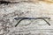 Glasses rimless frame contemporary style on grungy wood background