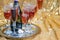 glasses of rose champagne on sparkling golden cloth
