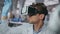 Glasses scientist controlling virtual reality in neuroscience laboratory closeup