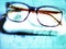 Glasses for the sight on a light blue background Modern eyeglasses with progressive lenses