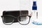 Glasses, spectacle case, liquid in a bottle, white background