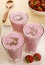 Glasses of Sweet Strawberry Lassi and Strawberries
