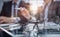 glasses on the table in the office on a blurred background of colleagues