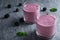 Glasses with tasty blackberry yogurt smoothies