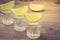 Glasses of tequila with a lime/glasses of tequila with a lime. selective focus