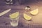 Glasses of tequila with a lime/preparation of shot with a lime in a shaker. Top view