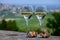 Glasses white wine from vineyards of Sancerre Chavignol appelation and example of flint pebbles soil, near Sancerre village, Cher