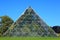 Glasshouse pyramid in park