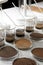 Glassware with soil samples and extracts on table. Laboratory research