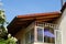 Glazed balcony under the roof is reminiscent of the idyllic Biedermeier period