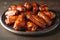 Glazed Barbecue Chicken Wings on Plate.