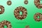 Glazed brown sweet sugar chocolate doughnut donut dessert on gradient green pastel background. Creative minimal blurred selective