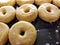 Glazed donuts on bakery shelf