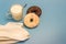 Glazed donuts, milk, spoon and napkin on a blue background