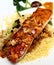 Glazed salmon with sliced almonds on couscous