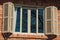 Glazed window with shutters in a country house