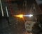 Glazier with gas torch lit while blending a piece of glass 2