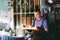 Glazier worker cutting glass with fire in a workshop