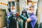 Glazier worker in face mask holding glass in workshop