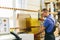 Glazier worker preparing glass in workshop. Industry