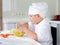 Gleeful young chef baking in the kitchen