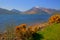 Glen coe mountains with snow topped mountains and yellow flowers Loch Leven Lochaber Geopark Scotland uk