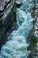 Glen Creek framed by rocky bank in Gorge trail in Watkins Glen state park