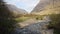 Glencoe river Clachaig Scotland UK with mountains in Scottish Highlands in spring with people