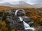 Glencoe waterfall with mountains in the background