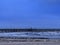 Glenelg jetty and beach under the storm with thick cloud and blue tone