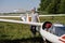 Glider pilot getting ready for flight on small motorless aircraft