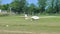 Glider, sailplane, takes off towed by an airplane