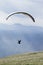 Glider takes off over the lake and the mountains