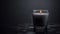 Glimmers of Darkness: Black Candle in Glass Beaker on a Matte Blurred Surface